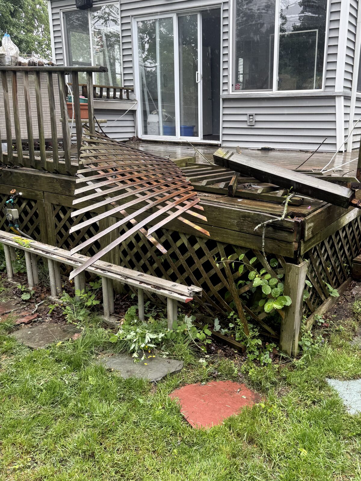 Collapsed railing and lattice on an old deck