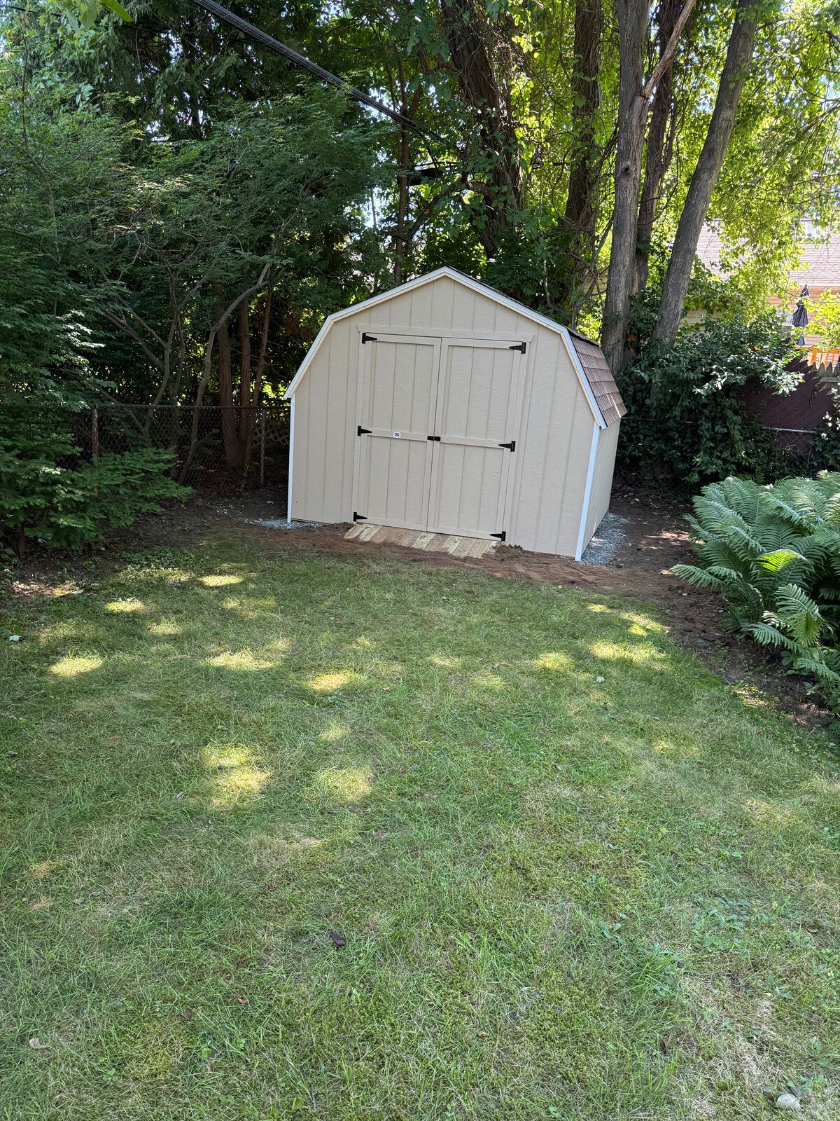 Gambrel-style shed with double doors