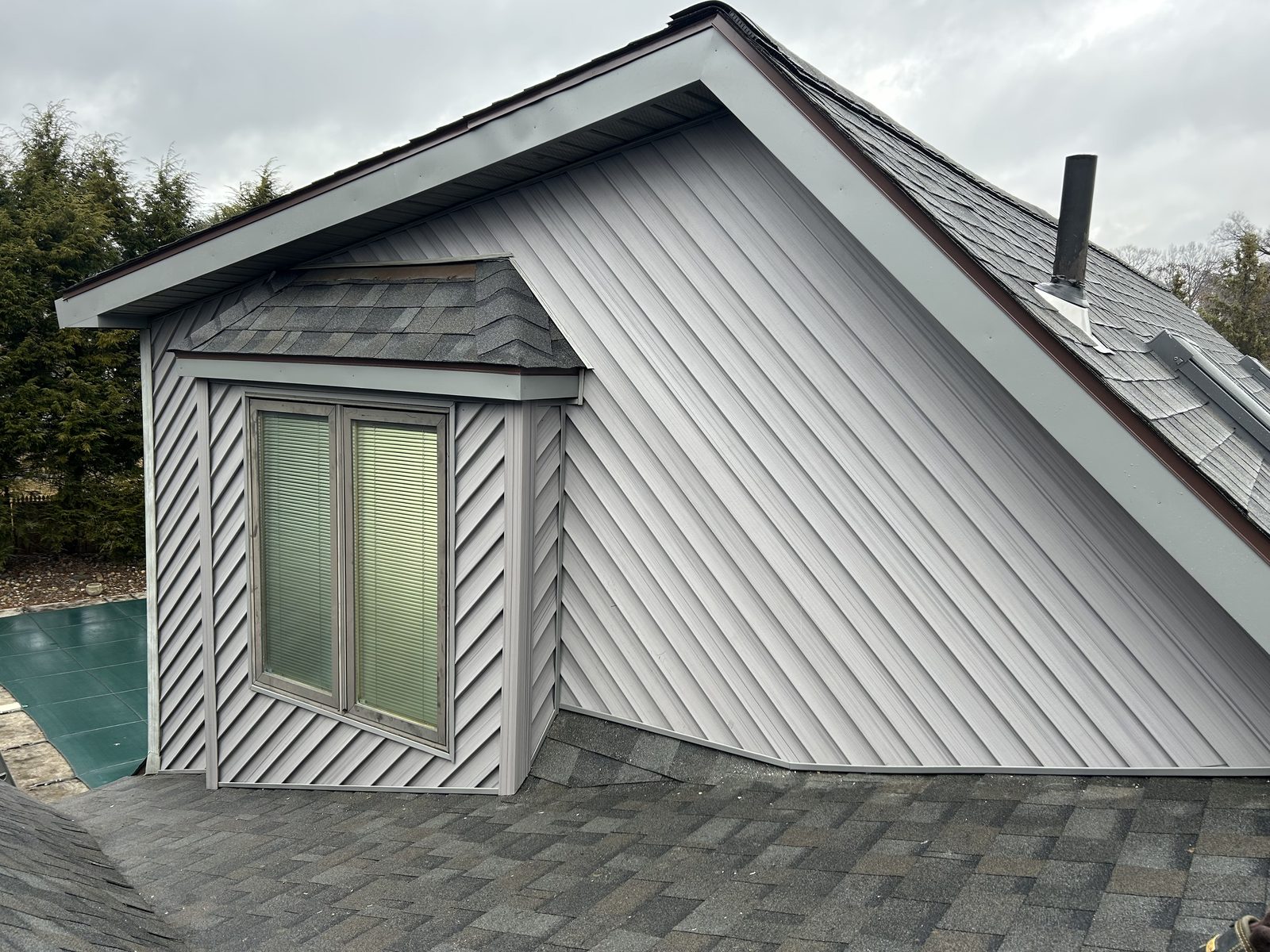 Diagonal siding on a gable wall and dormer